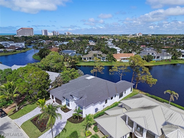 aerial view with a residential view and a water view