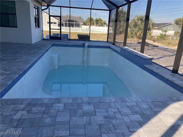 view of pool with a lanai and a patio area