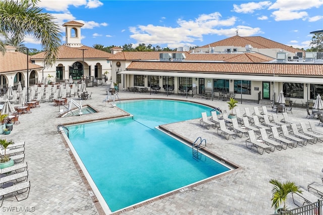 view of swimming pool featuring a patio area