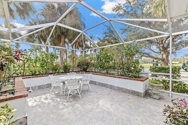 view of patio with a lanai