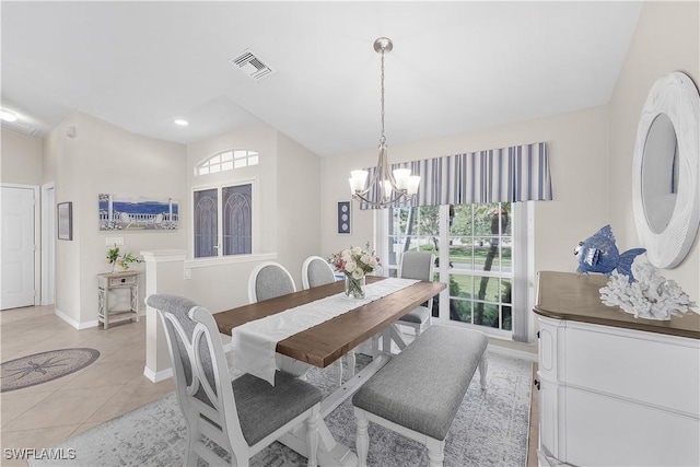 tiled dining space with a notable chandelier