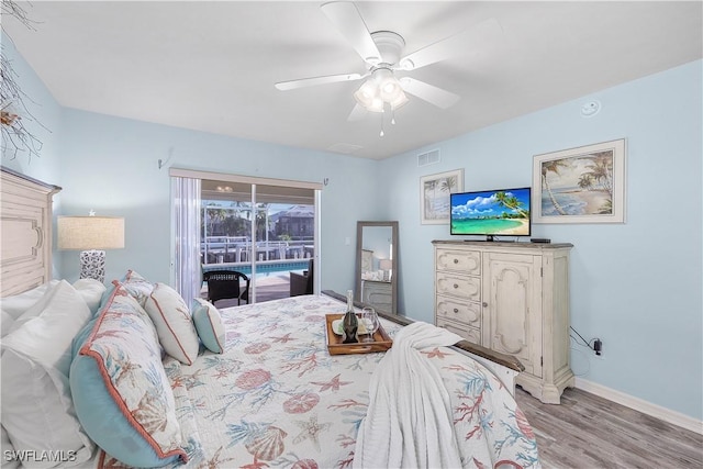 bedroom featuring access to exterior, light hardwood / wood-style floors, and ceiling fan