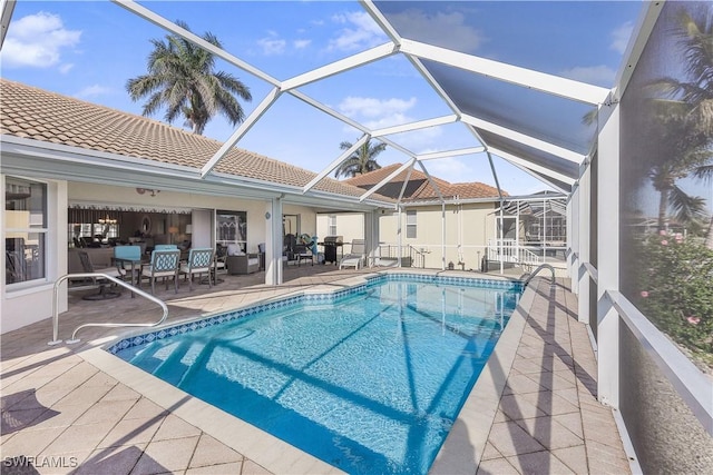 view of pool with a lanai and a patio