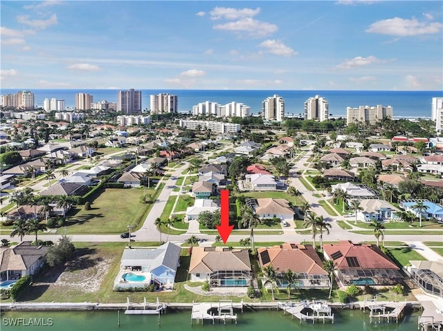 birds eye view of property featuring a water view