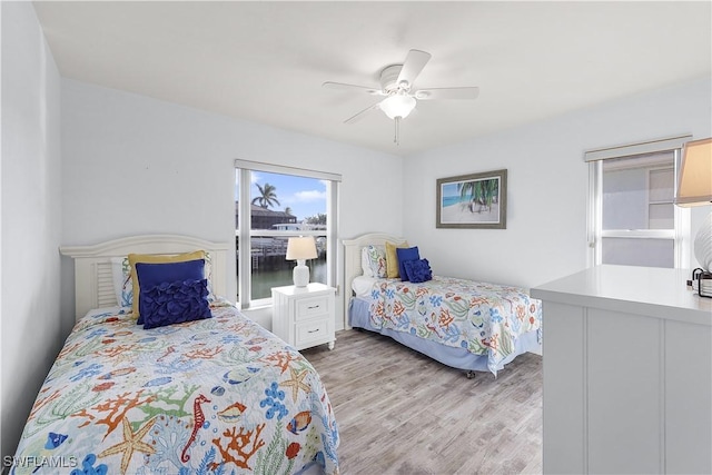 bedroom featuring light hardwood / wood-style flooring and ceiling fan