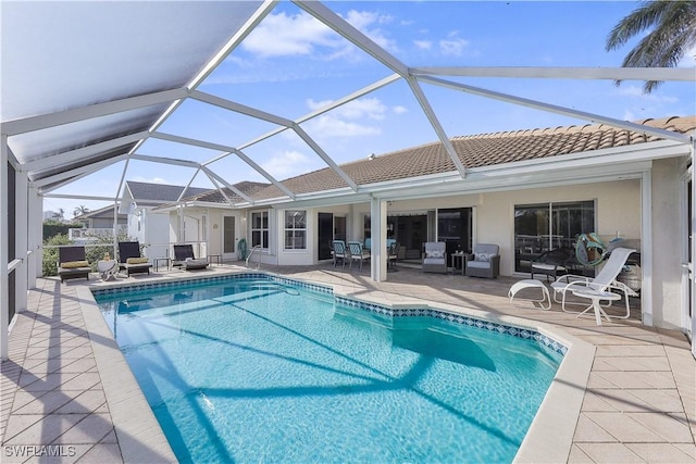 view of pool featuring a lanai and a patio