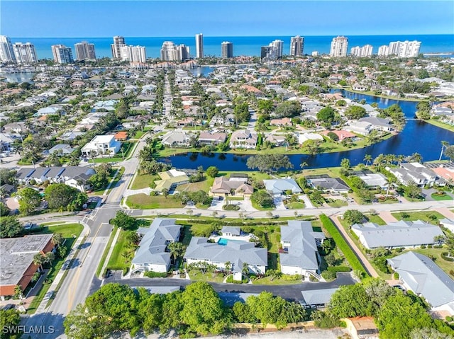 birds eye view of property featuring a water view