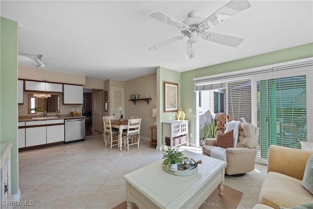 tiled living room with sink and ceiling fan