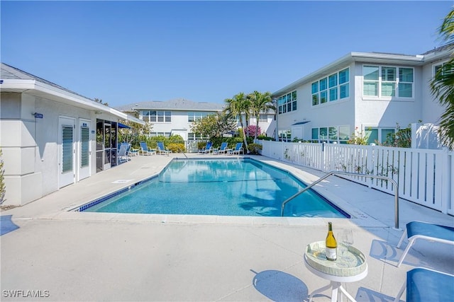 view of swimming pool with a patio