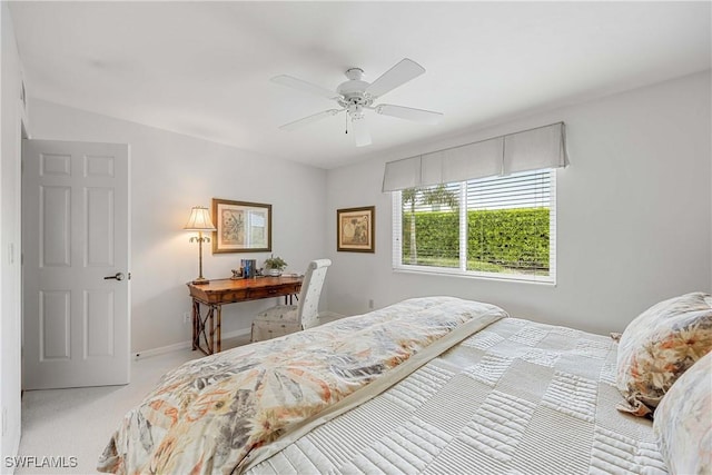 bedroom with light colored carpet and ceiling fan