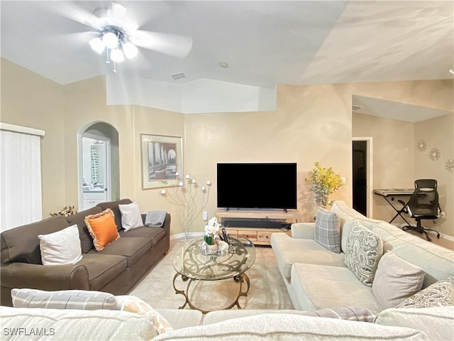 living room with ceiling fan and lofted ceiling