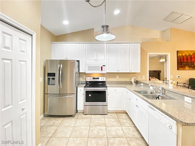 kitchen featuring hanging light fixtures, kitchen peninsula, lofted ceiling, white cabinets, and appliances with stainless steel finishes