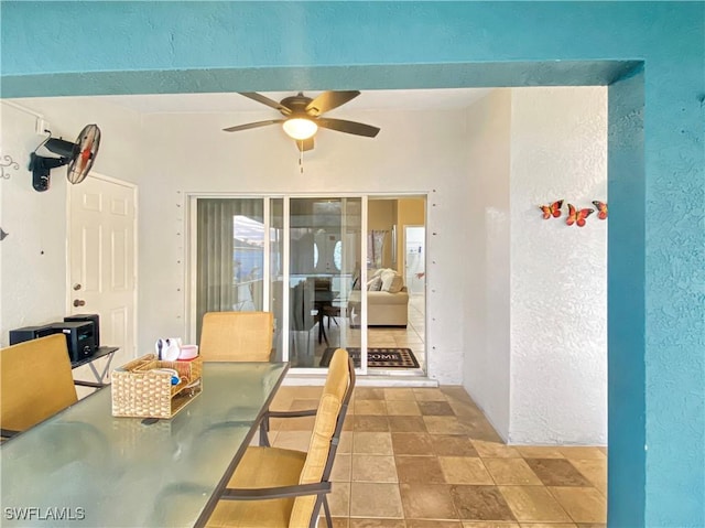 dining area with ceiling fan