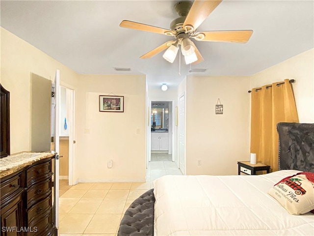 tiled bedroom featuring ceiling fan