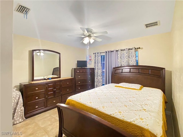 tiled bedroom with ceiling fan