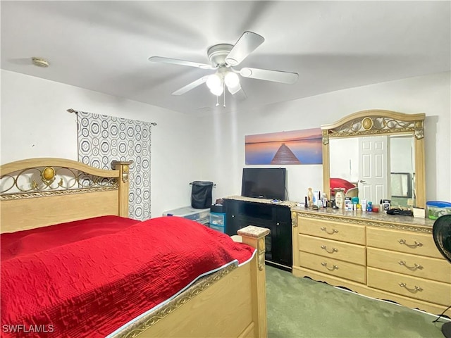 bedroom featuring light colored carpet and ceiling fan