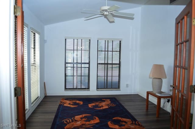 sitting room featuring ceiling fan, dark wood-type flooring, and vaulted ceiling