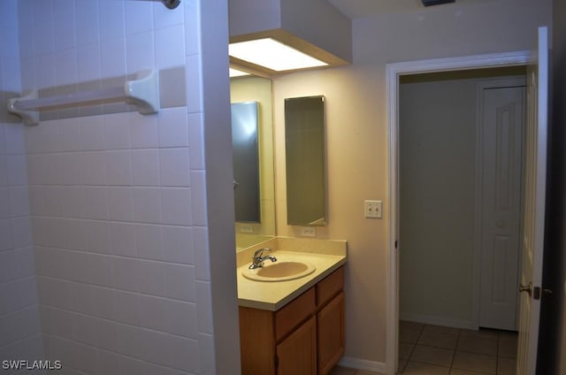 bathroom featuring tile patterned flooring and vanity