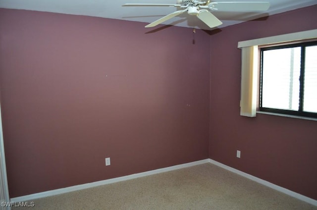 spare room with ceiling fan and carpet floors