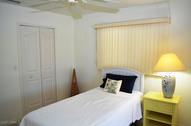 bedroom featuring ceiling fan and a closet