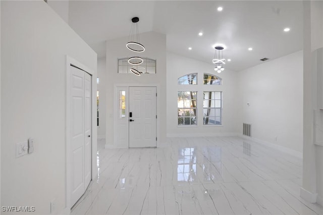 entrance foyer with lofted ceiling