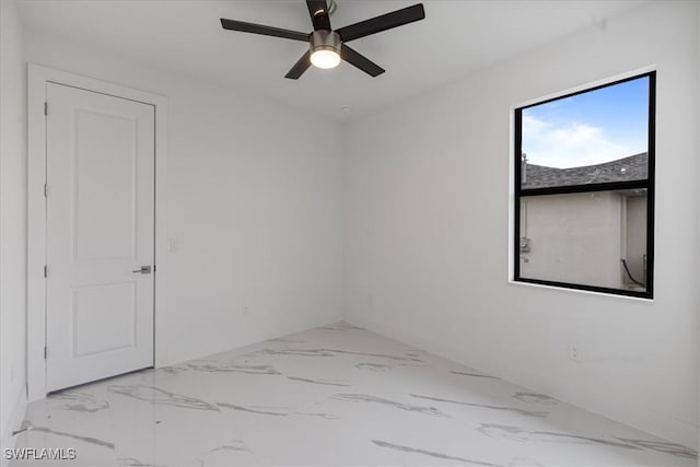 unfurnished room with ceiling fan