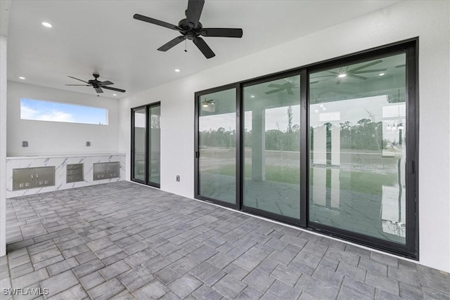 view of patio with ceiling fan