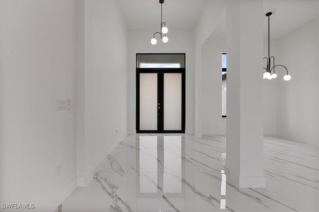 foyer entrance featuring french doors