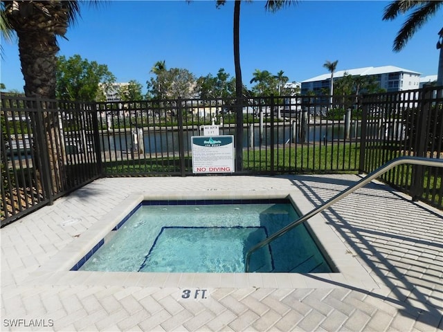 view of swimming pool with a water view