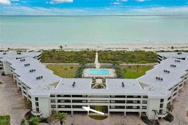 birds eye view of property featuring a water view and a view of the beach