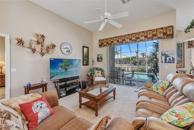 living room with ceiling fan and carpet floors