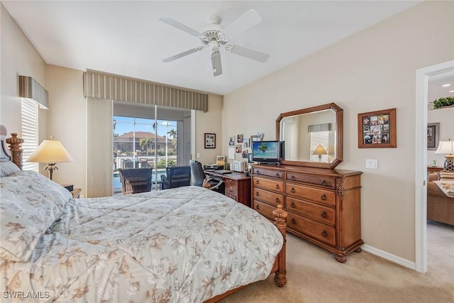 bedroom featuring access to outside, light colored carpet, and ceiling fan