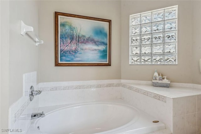 bathroom featuring a tub to relax in