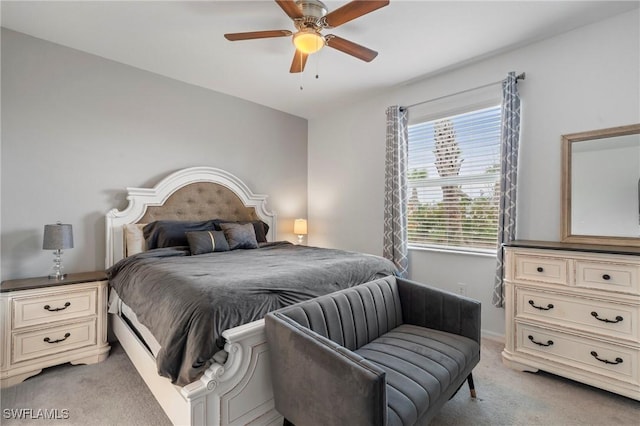 bedroom featuring ceiling fan and light colored carpet