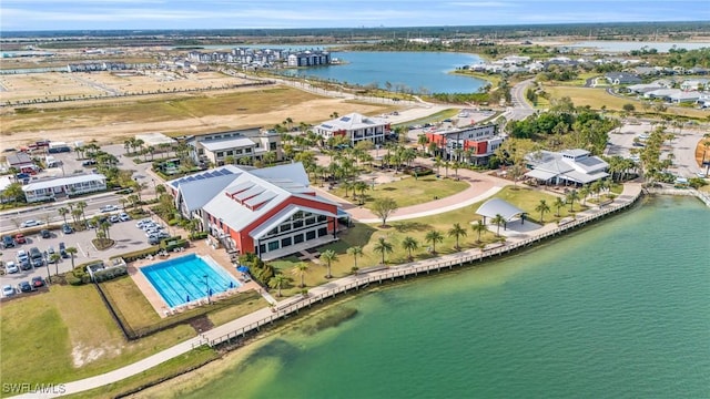 birds eye view of property with a water view