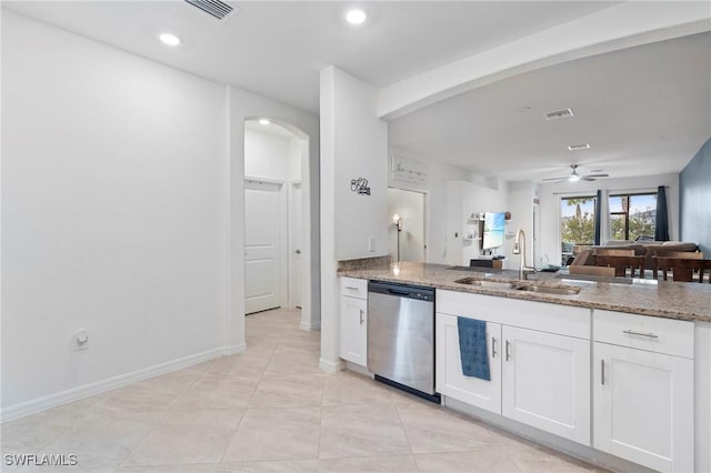 kitchen featuring light stone countertops, dishwasher, white cabinetry, sink, and ceiling fan