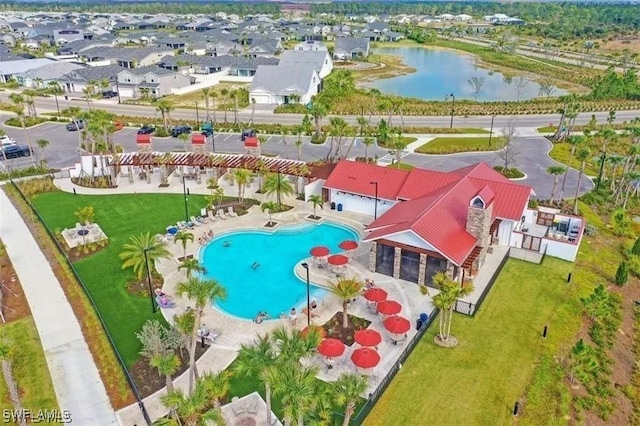 birds eye view of property featuring a water view