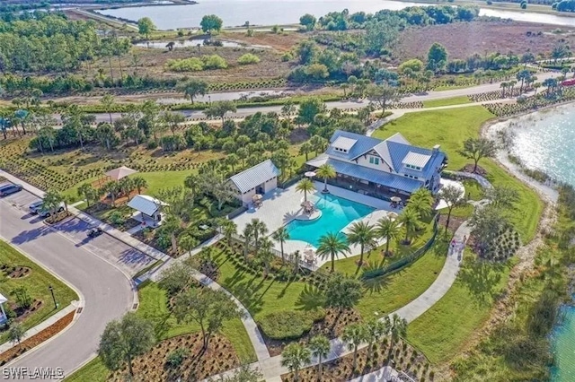 birds eye view of property with a water view