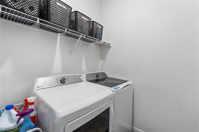 laundry area with washing machine and dryer