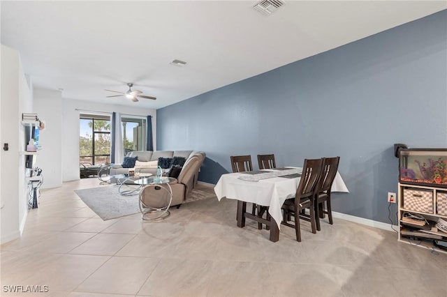 living room with ceiling fan and light tile patterned floors