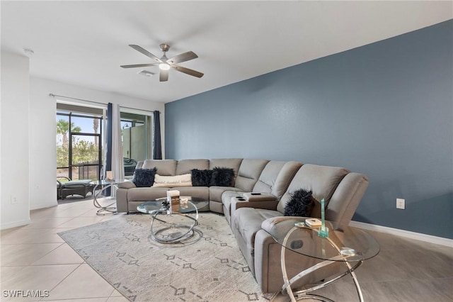 living room with ceiling fan and light tile patterned flooring