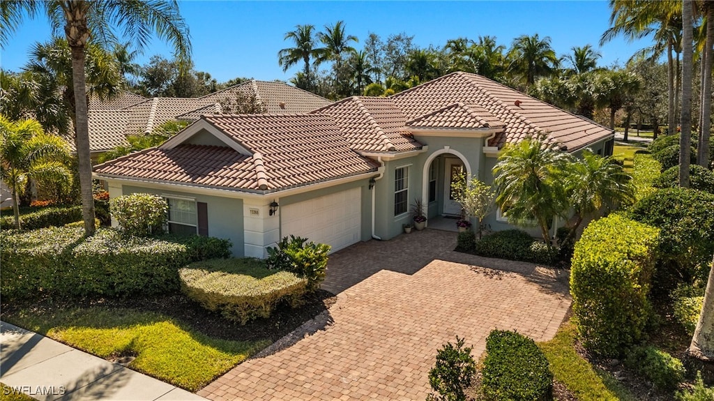 mediterranean / spanish-style house featuring a garage