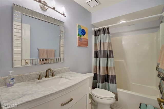 full bathroom with toilet, vanity, and shower / tub combo with curtain