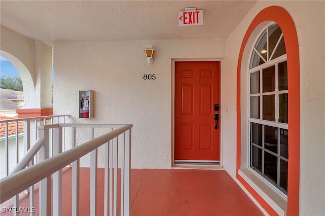 doorway to property featuring a balcony