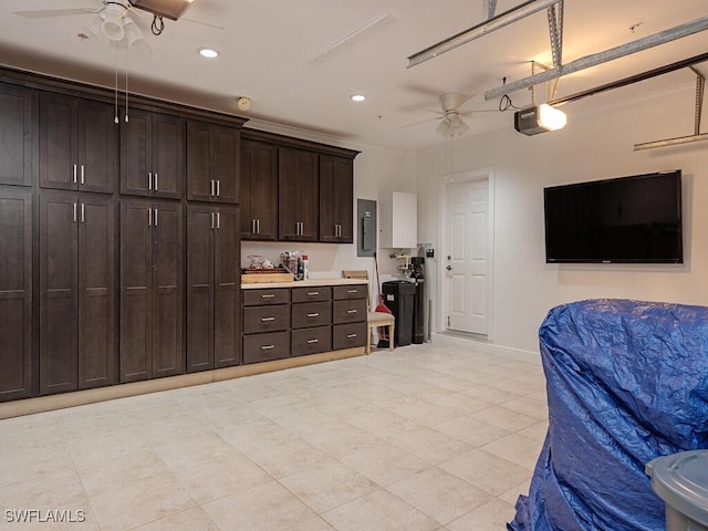 kitchen featuring ceiling fan, dark brown cabinetry, and electric panel