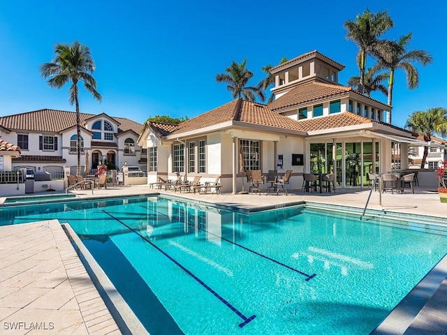 view of swimming pool with a patio