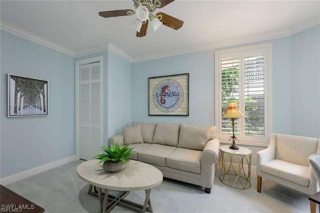 living room with ceiling fan, light colored carpet, and crown molding