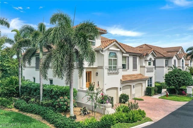 mediterranean / spanish-style home featuring a garage