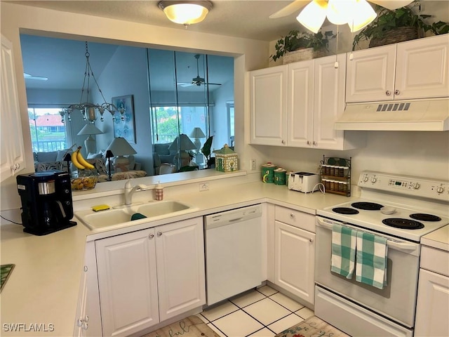 kitchen with white cabinetry, white appliances, sink, and light tile patterned floors