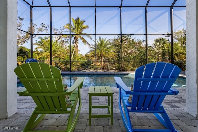 view of patio featuring a lanai